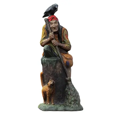 Sculpture fairy-tale character Baba Yaga in a mortar with a broom