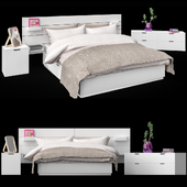Кровать Нордли от IKEA с изголовьем, комодом и тумбой.