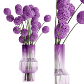 Spherical bouquet inserted into a glass vase