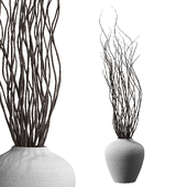Dry branches in stucco vase